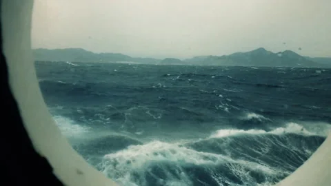 A ship in a storm at sea, high waves shake the ship, waves in the sea. Stock Footage 194006043