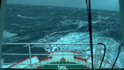 Ship in storm. Splashes from waves on window of wheelhouse. Window wiper is Stock Footage 243392492