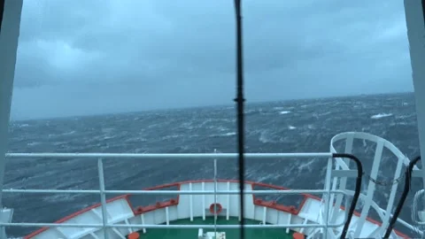 Ship in storm. View from bridge. High waves. Vessel climb up wave. Strong Stock Footage 172006299