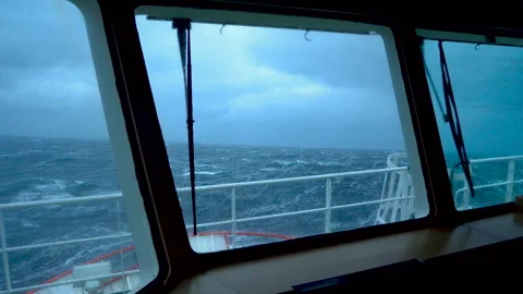 Ship in storm. View from bridge. Ship climb up wave. A lot of splashes on Stock Footage 271155894