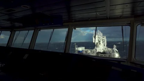 Ship in storm. View from navigation bridge. White foam on waves. Window wiper is Stock Footage 257818165