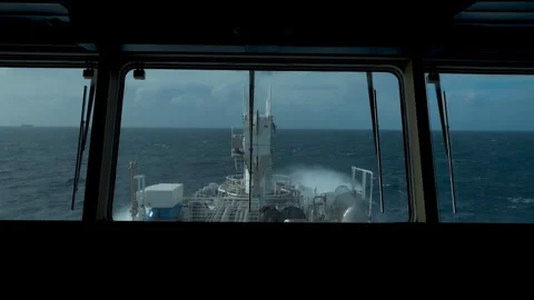 Ship in storm. View from wheelhouse. Splashes of waves above bow of vessel Stock Footage 255245683