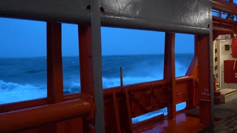 Ship in storm. Waves along vessel. Side view on high waves. Strong pitching Stock Footage 266540439