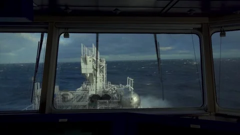 Ship in storm. Window wiper is working. Splashes from waves on window of Stock Footage 251542437
