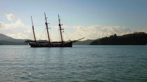 Ship with three masts floating beside coast Stock Footage 88603883