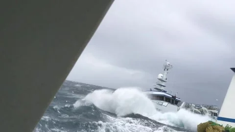 Ship tossed around like a toy in rough seas off the coast of Scotland Stock Footage 276495149