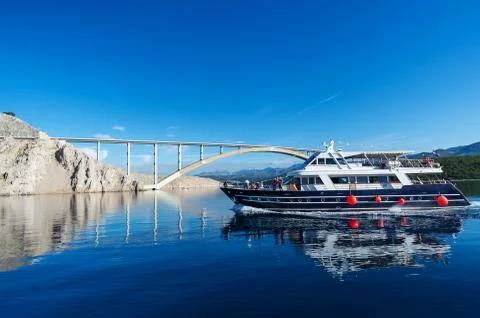 Ship with tourists. Bridge on Krk Island in Croatia Stock Photos