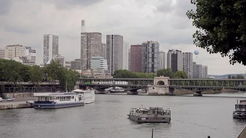 A ship with tourists turns in the middle of the river Seine  in Paris Stock Footage 80411421