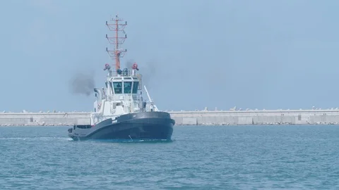 A ship is towing within a port Stock Footage 118758836