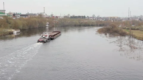 Ship tows a barge on the river. The view from the top Stock Footage 88597862