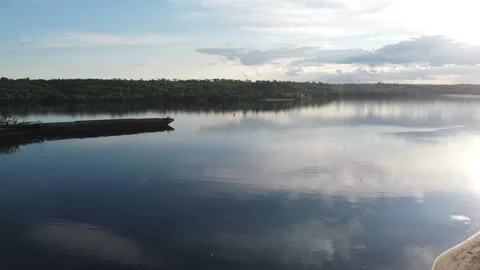 Ship tows cargo along the river Stock Footage 131781945