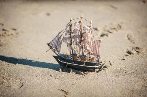 Ship is a toy in the sand Stock Photos
