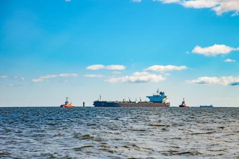 Ship with tugs Stock Photos