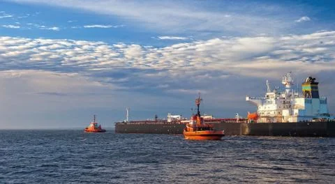 Ship with tugs Stock Photos