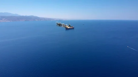 Ship under attack in gulf sea With fire Smoke And Helicopter Aerial Illstration Stock Footage 117403239