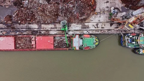 Ship unloading cargo at shipyard site in busy industrial area 스톡 동영상 337941950
