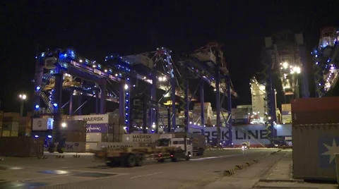 Ship unloading at night Stock Footage 1079493