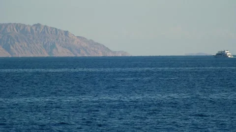 Ship vessel sails in the Red Sea off the coast of Tiran Island Stock Footage 317549997