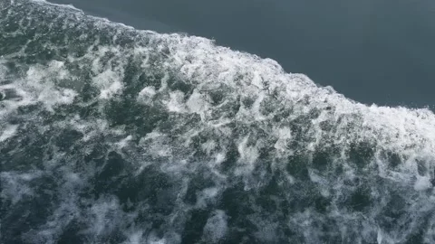Ship wake in dark green emerald water of side of boat Stock Footage 283593299
