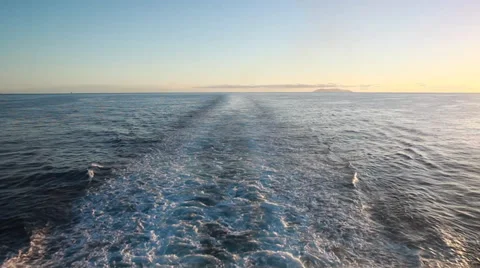 Ship wake on the ocean. Water foam trace behind the large ship goes to horizon. Stock Footage 39465959
