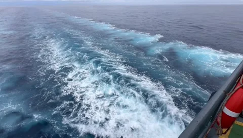 Ship Wake Trailing Behind Vessel in Open Ocean Stock Footage 336590347