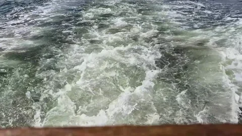 Ship wake waves behind a moving boat, foamy water trail and engine turbulence Stock Footage 335401660