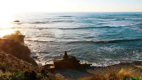 Ship wreck decaying at the beach during sunset, Portugal Stock Footage 87330661