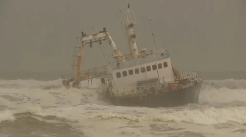 Ship wreck in rolling waves at Skeleton Coast, Namibia Stock Footage 33626856