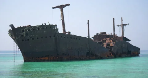 Ship wreck stranded near shore - old sunken ship stuck in coral reef 2 Stock Footage