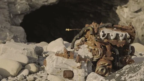 Ship Wrecks by a Cave Stock Footage 79658664