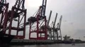 Shipping along dockside with container ships in Hamburg harbour HD Footage