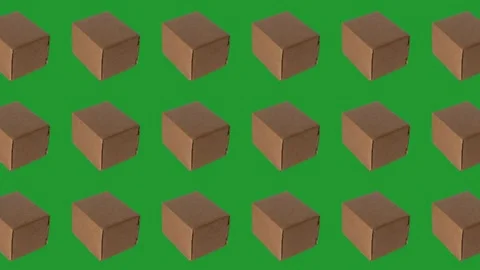 Shipping boxes are arranged in a pattern on a green background Stock Footage 341977122