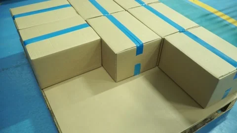 Shipping boxes on pallets. Massive of pallets with cardboard boxes Stock-Footage 134552160