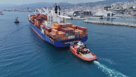 Shipping cargo logistics: Container ship enters Genoa port with tug Video stock 345524242