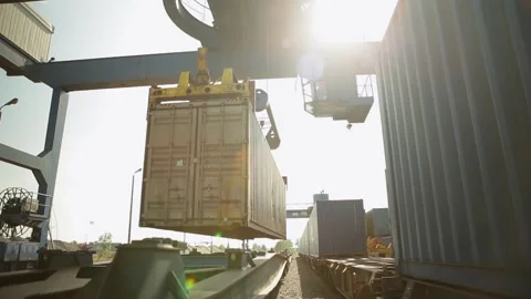 Shipping container being lifted by crane at industrial port, sunny day, Video stock 274828757