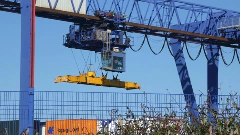 Shipping container crane lift machine lo... | Stock Video | Pond5