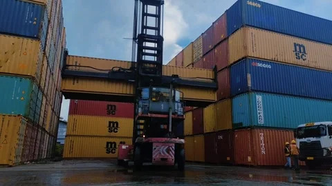 Shipping container lifting, Cargo containers are being loaded Stock Footage 312021588