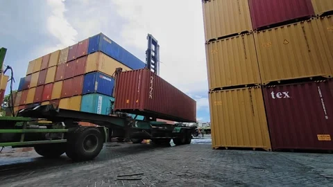 Shipping Container lifting of  side loader a large yellow shipping container Stock Footage 312021327