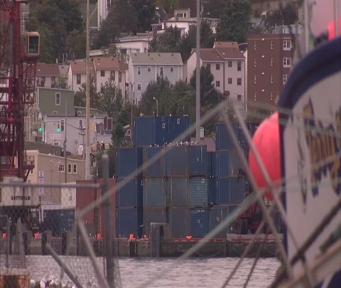 Shipping containers and tangle of ropes in fishing village Stock Footage 86699004