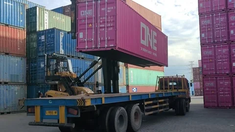 Shipping containers lifting Being Loaded onto Truck at Port Stock Footage 297096908