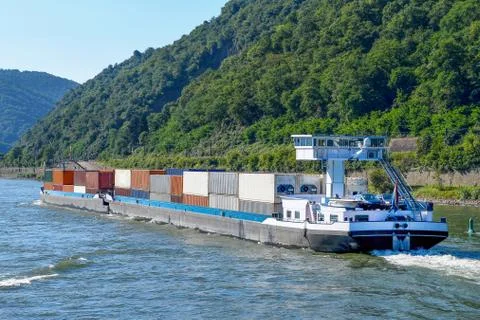 Shipping containers on river barge Stock Photos