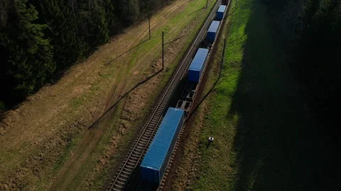 Shipping containers transportation on freight train by railway. Stock Footage 190073083