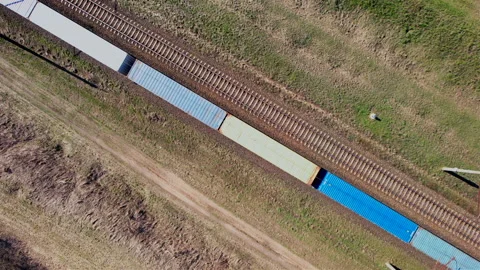 Shipping containers transportation on freight train by railway. Stock Footage 190077911