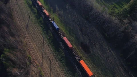 Shipping containers transportation on freight train by railway. 库存影片 190078313
