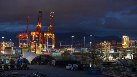 Shipping cranes unloading containers in timelapse wide shot Stock Footage 149380282