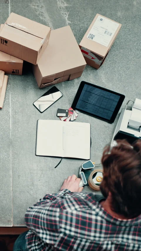 Shipping, man and packing box in leather workshop for delivery, ecommerce and Stock Footage 332928053
