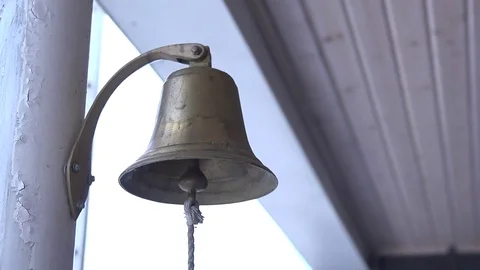A ship's bell hangs on a pole Stock Footage 75779241