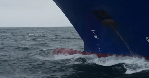 Ships bow cuts deep through water with hidden bulbous nose Stock-Footage 321774781