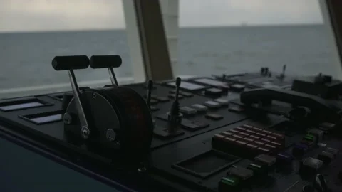 Ship's bridge. Control panel. Throttle. Pitching. Sea in background Stock Footage 169454332