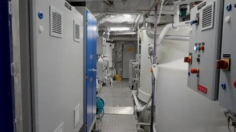 Ships Captain running through engine room area during emergency Stock Footage 259864618